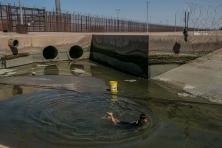 Dilan Rodríguez, 8, fishing in the canal that runs adjacent to the dry Colorado River at the border of Mexico and the US on 6 September 2019.