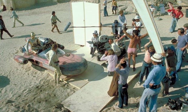 Ken Nightingall, holding boom mike and wearing pink shorts on the set of Star Wars