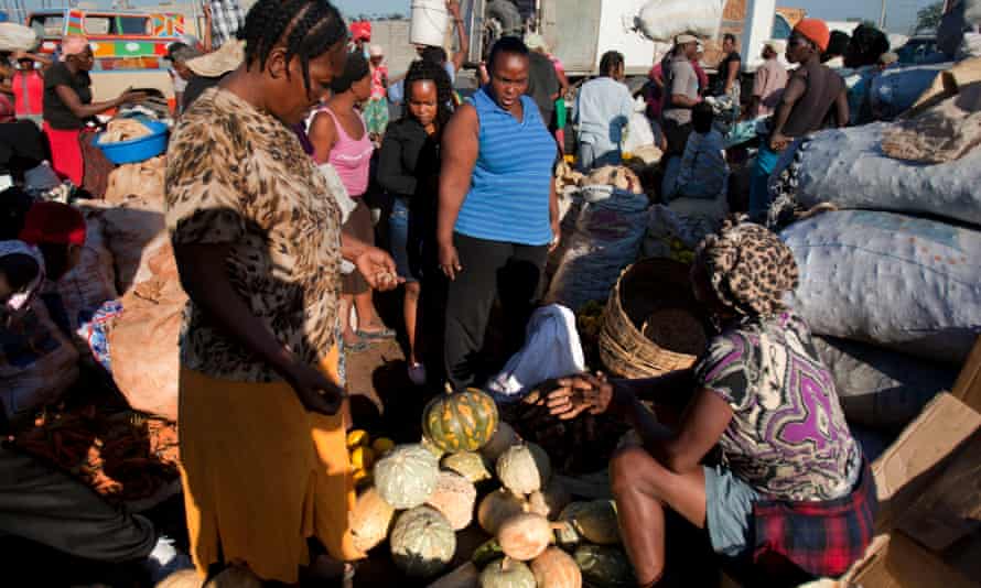 Shopping on New Year’s Eve for squash to make joumou soup for independence day, Port-au-Prince, Haiti.