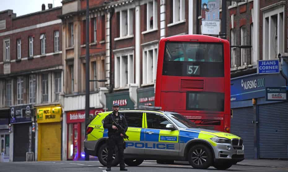 An armed policeman in Streatham after a man with a knife was shot dead.