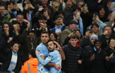Manchester City's Rodri celebrates scoring their second goal with Bernardo Silva.