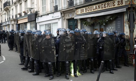 French police secure a position as clashes erupted with protesters during a national strike against the government’s reform of the pension system, in Paris, France.