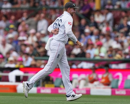 Joe Root runs from the field reaching for his back on day two of the fifth Ashes Test at the SCG