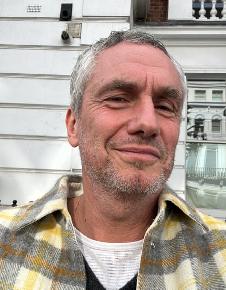 Author Rowan Somerville standing outside in front of a building