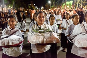 School children carrying symbols of Christ crucifixion, including a crown of thorns, chains and nails, lead a procession through the streets of Larantuka. The course covers a distance of seven kilometres and continues for most of the night on the evening of Good Friday.