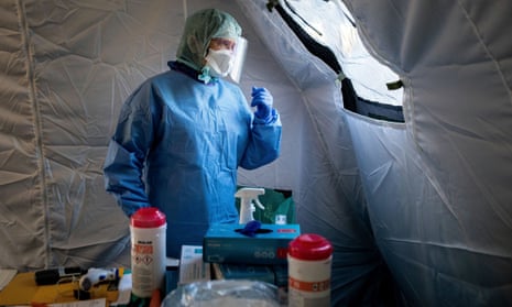 A doctor waits for patients in a special tent for Covid-19 patients near a hospital in Lublin, Poland.