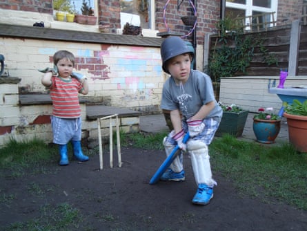 Youngster playing cricket in the garden by Tanya Aldred in Manchester in 2011.