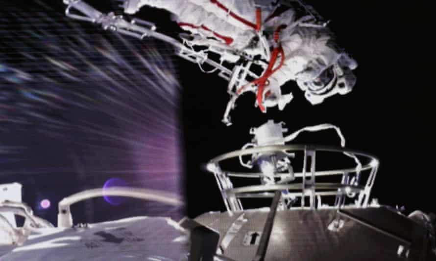 A screen image of one of the astronauts on the spacewalk