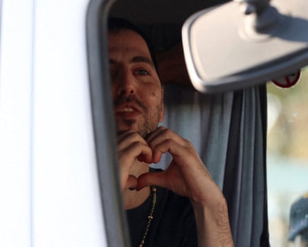Elkana Bohbot makes a heart gesture with his hands