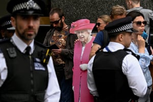 A person holds a cut-out depicting Queen Elizabeth outside St Paul’s Cathedral ahead of the National Service of Thanksgiving which is being held as part of celebrations marking the queen’s Platinum Jubilee