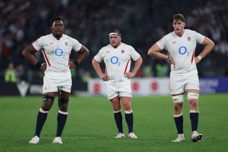 Maro Itoje, Jamie George and Alex Coles look on during a break in play