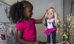Jayla, aged 4, plays with a My Friend Cayla doll in the Hamleys toy shop in London.