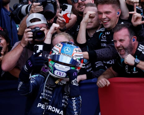Kimi Antonelli celebrates with members of his Mercedes team after winning the US Grand Prix