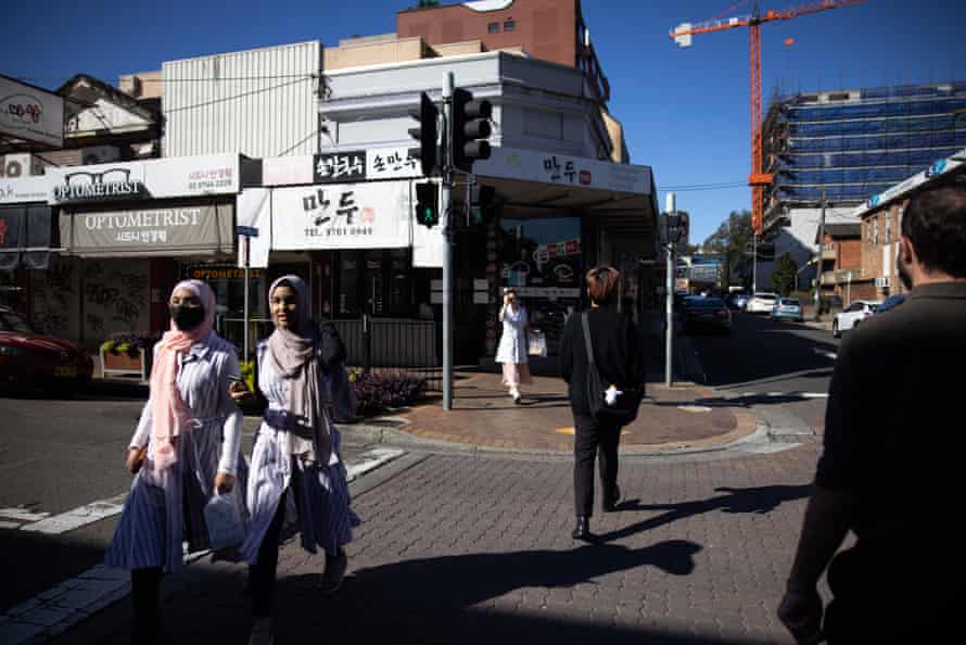 Women cross the street in Strathfield, in the marginal electorate of Reid.