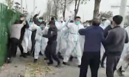 Footage shot at the protest showing security personnel in protective clothing attacking a man.