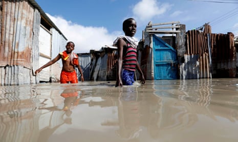 Somali children wade through flood waters after heavy rain in Mogadishu.