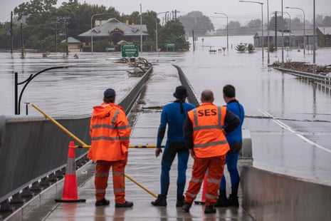 State Emergency Service members look over flood waters in Richmond,  New South Wales, in March 2022.