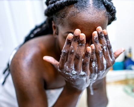 Woman washing her face