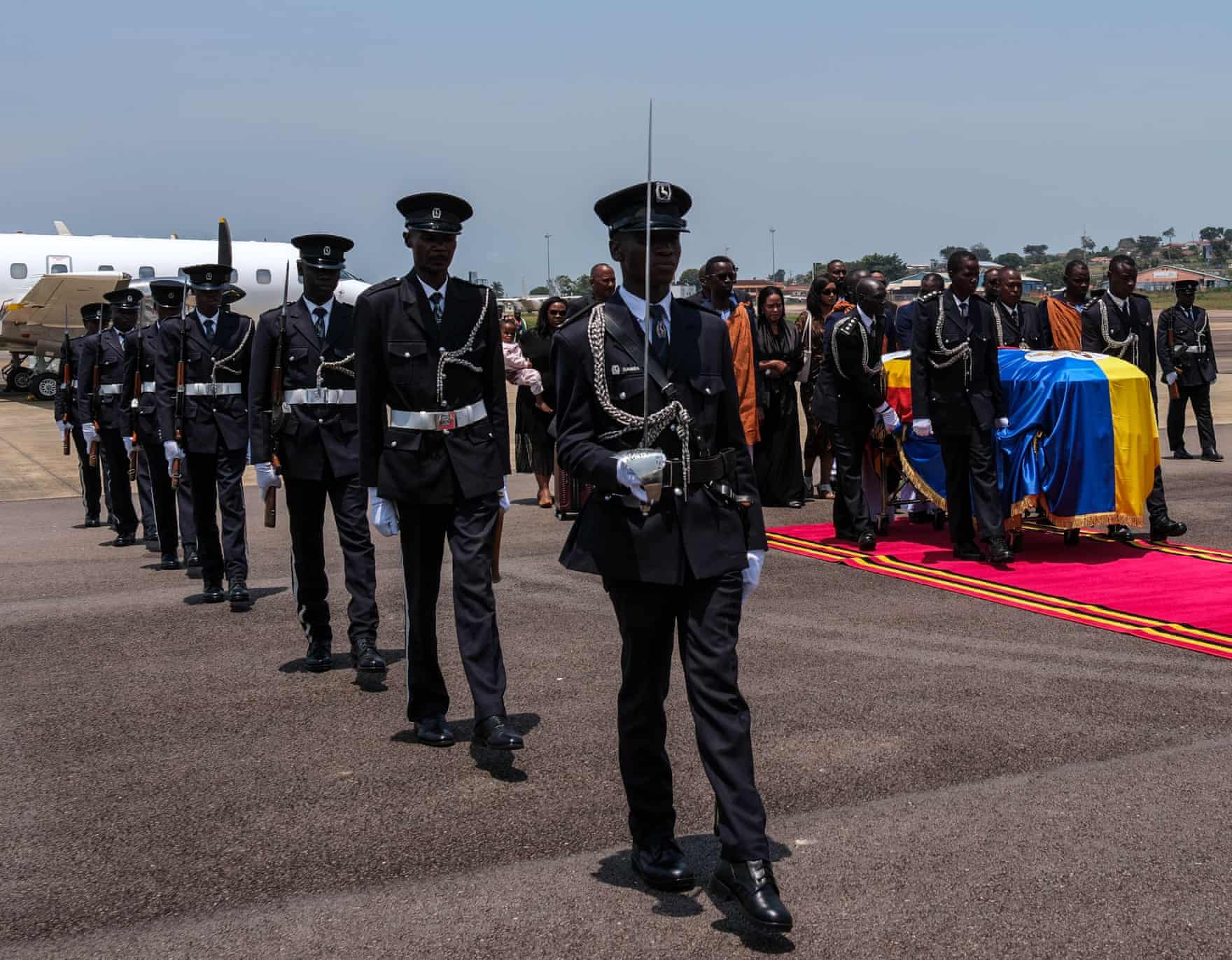 The casket of the late king arrives at Entebbe International airport accompanied by military personnel