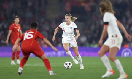 Leah Williamson carries the ball forward against North Macedonia