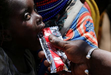 A girl is fed with ready-to-use supplementary food for the management of moderate acute malnutrition at a Unicef and Kenya Red Cross clinic in Kakimat village in Turkana, Kenya