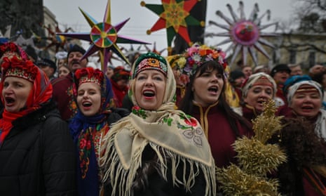 Participants sing Christmas carols during the Christmas Stars festival outside Taras Shevchenko monument, on the Orthodox second day of Christmas, in Lviv, Ukraine on 8 January.