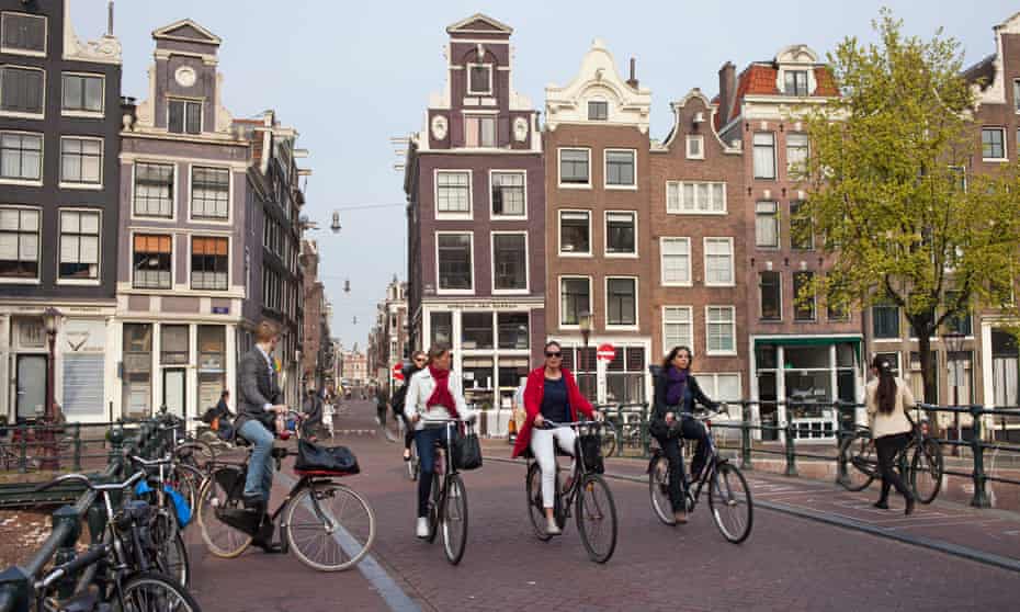 People ride bicycles in Amsterdam