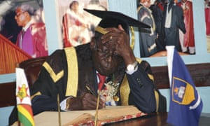 Robert Mugabe in his university mortar board.