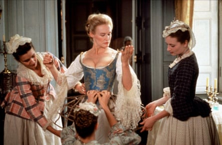 Glenn Close, in elaborate 18th-century corset dress, is attended to by three ladies’ maids