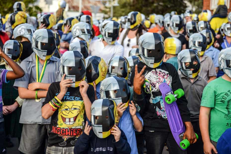 A group of Daft Punk fans and locals in masks at the Wee Waa show