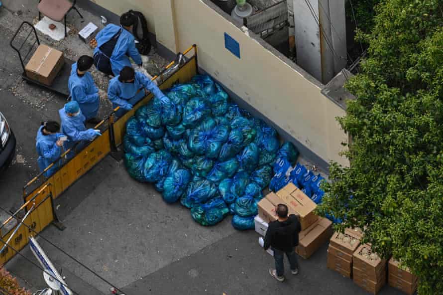 Workers sorting bags of vegetables to be delivered to residents in the Jing’an district of Shanghai