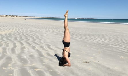 Bangarra dancer Tara Gower does yoga on Cable Beach, WA, during the coronavirus pandemic.