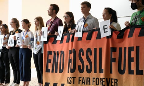 The entrance to the plenary hall at Cop28 is lined with activists telling countries to “hold the line” and phase out fossil fuels.