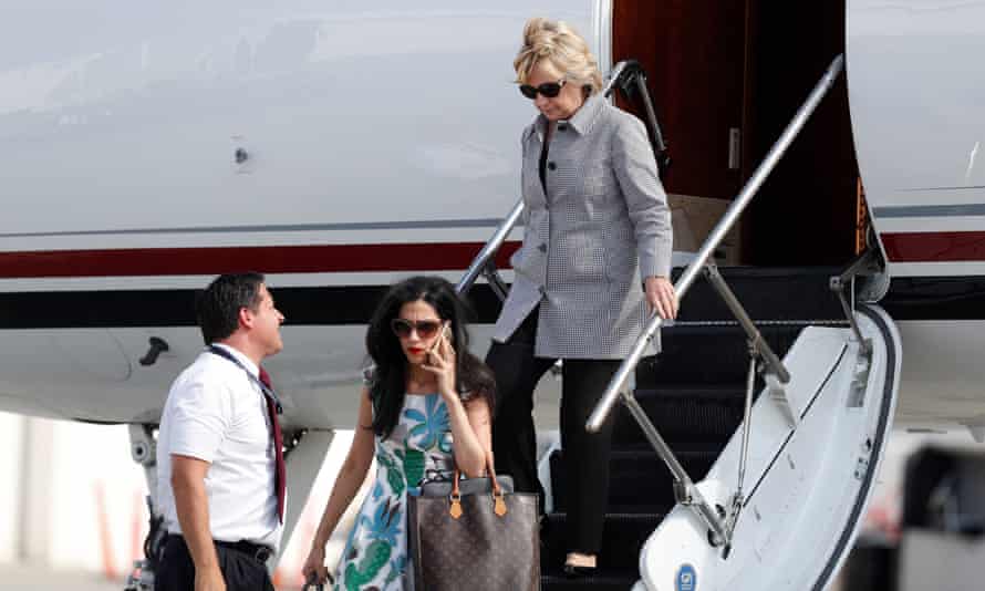 Democratic statesmanlike nominee Hillary Clinton and adjutant Huma Abedin, little near connected compartment phone, measurement from Clinton’s run level arsenic they get astatine Van Nuys Airport successful Van Nuys, Calif., Monday, Aug. 22, 2016