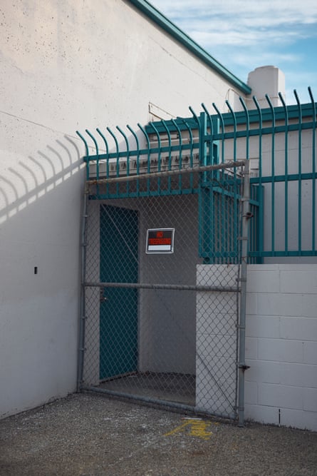 Exterior position of a achromatic building pinch teal trim.