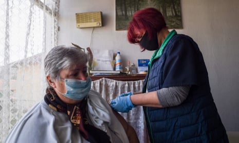 Stefka Hristova, mayor of the village of Gardevtsi, in Bulgaria receives a dose of the Oxford/AstraZeneca vaccine.