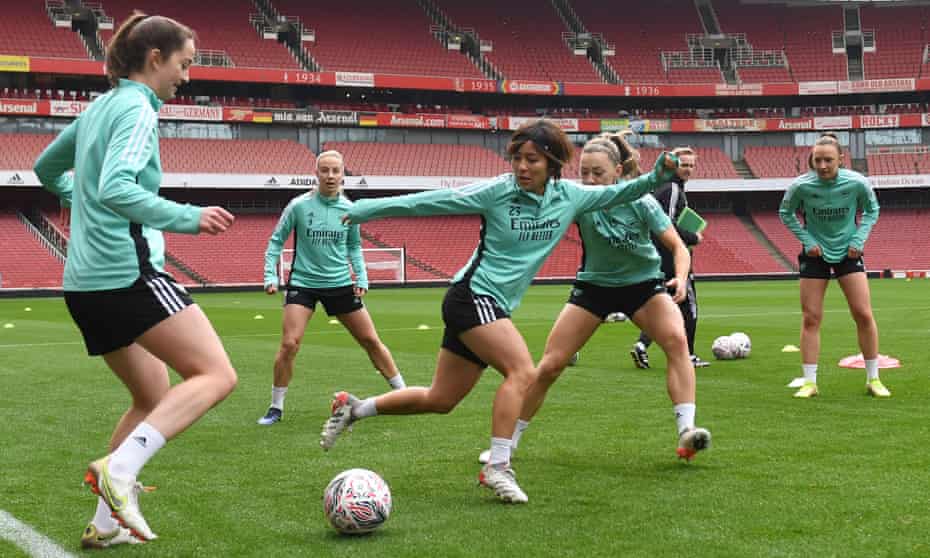 Arsenal players train at the Emirates Stadium on Friday