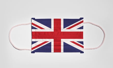 Face mask, decorated with UK flag, lying flat with elastic bands sticking out
