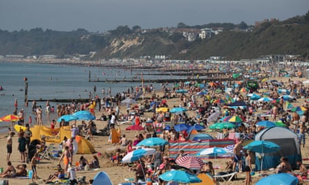 People enjoy the sunshine on Bournemouth beach during the late August bank holiday 2019.