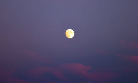 orange-y moon in a purple sky