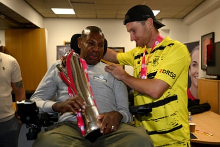 James Bracey of Gloucestershire presents David Lawrence with the trophy after winning the T20 Blast final against Somerset at Edgbaston