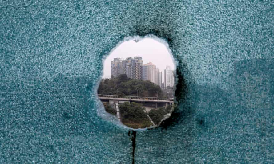 A shattered window is seen during a search operation at Hong Kong Polytechnic University