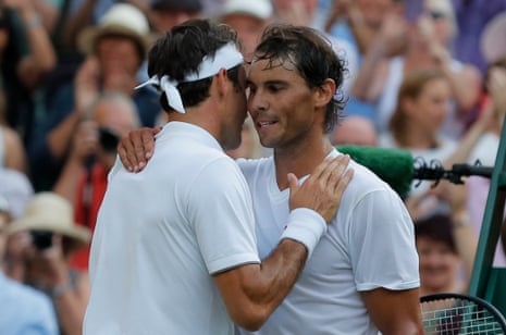 Federer and Nadal embrace at the net.