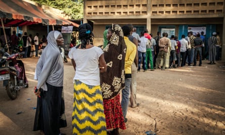 People queue outside a polling station in Ouagadougou, Burkina Faso