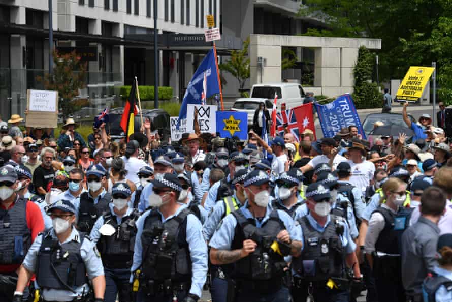 Protesters, including United Australia party supporters, gather outside the National Press Club during Morrison’s speech.