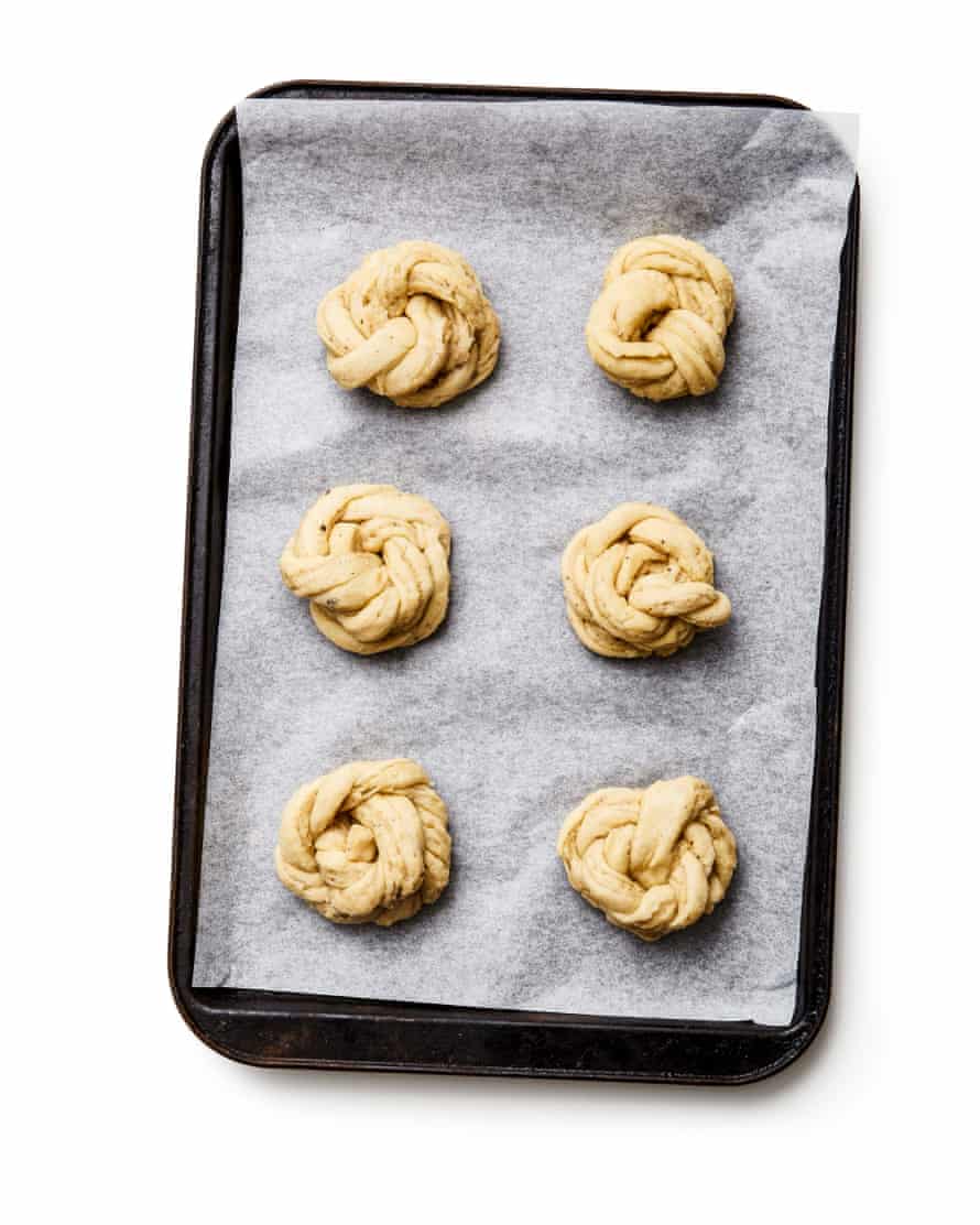 Felicity Cloake’s perfect cardamom buns – step 8a. Arrange the buns, well spaced out, on the lined trays, cover and leave to rise again for an hour.