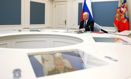 President Putin inspects the exercise to test delivering a massive retaliatory nuclear strike, via video link from Moscow