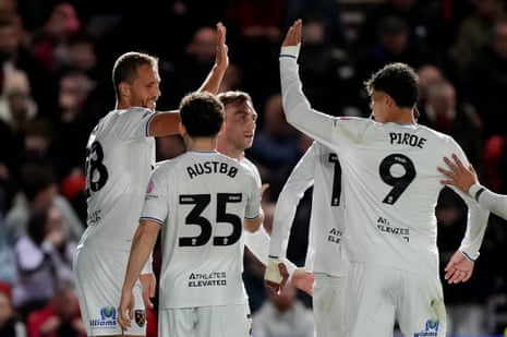 Tomas Soucek (left) is congratulated by his teammates after scoring the first of his two goals late on against Lincoln