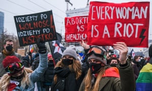 Poland's pro-democratic protests continue despite Covid-19<br>WARSAW, POLAND - DECEMBER 13: Women hold banners during a protest against the ruling government on December 13, 2020 in Warsaw, Poland. Since October 22nd, when the country's politicized Constitutional Tribunal ruled on a near-total abortion ban, protests have been ongoing. The protests started as an opposition to the tribunal's ruling, but now, united several factions of pro-democratic movements against the ruling right-wing government. Today marks 39 years since the authoritarian Polish People's Republic introduced martial law and 18 years since the European Union announcement of Poland joining the Union. (Photo by Omar Marques/Anadolu Agency via Getty Images)