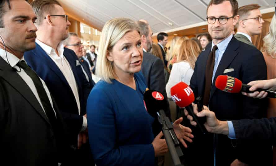 The Swedish prime minister, Magdalena Andersson (centre), talks to the media before a parliamentary debate on Sweden’s application for Natio membership